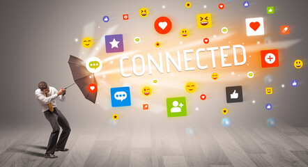 businessman defending with umbrella from social media