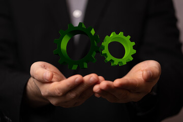 Set of green gears and cogs on black background