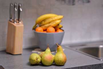 Fresh ripe pears in kitchen. Healthy vegan food. 