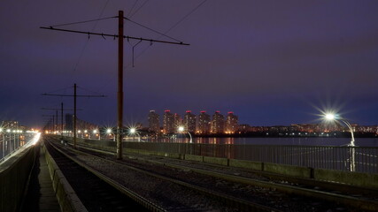 Fototapeta premium Old tram tracks on the North Bridge in Voronezh on an autumn evening
