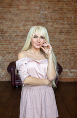 Fototapeta premium portrait of a beautiful young blonde woman with wonderful hair 