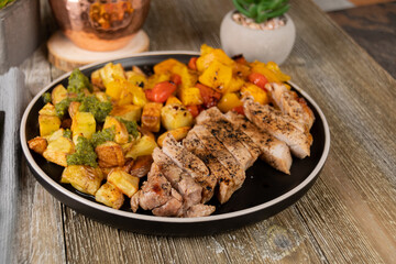 Italian Sheet Pan Pork Chops with Potatoes, Peppers, and Tomatoes 