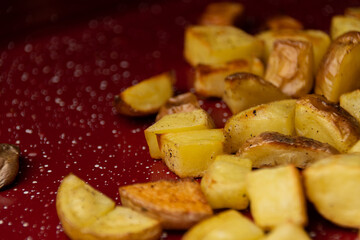 Roasted Potatoes on a Red Baking Sheet