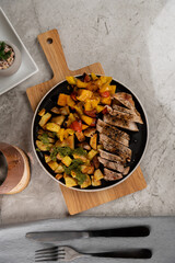 Italian Sheet Pan Pork Chops with Potatoes, Peppers, and Tomatoes 