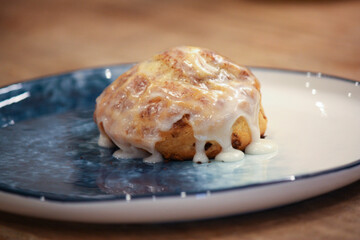 Delicious hot cinnamon roll with icing 