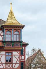 A half-timbered house with a golden roof gable, town hall, Schwabach, Bavaria, Germany