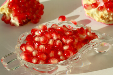 Bright juicy tasty red pomegranate fruit. Vitamins and benefits in every grain.