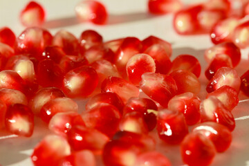 Bright juicy tasty red pomegranate fruit. Vitamins and benefits in every grain.