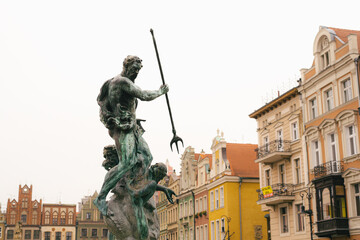 Fototapeta na wymiar Neptune Fountain in the center of the Polish city of Poznan near the town hall.