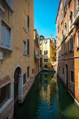 Fototapeta na wymiar Canal view in the city of Venice on a sunny day