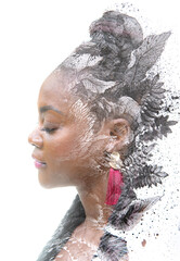 Paintography. A double exposure portrait of an African American woman combined foliage painted in ink.