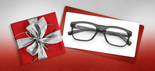 glasses christmas gift card, red box with glittering silver ribbon bow, white ticket and black...
