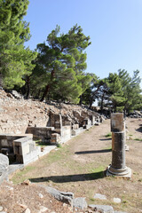 view of agora in ancient town Priene in Turkey with fragments of marble columns