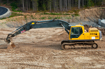 large excavator at construction. yellow tractor in the forest. mountain road construction concept. mining industry illustration © Григорий Юник