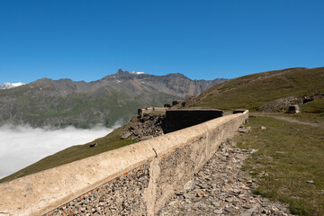 the wall of the Turra fort overlooking the Mont Cenis dam in the French Alps on the border with Italy