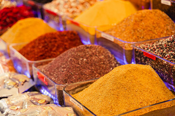 Assortment of spices in the Turkish market. Turmeric and pepper mix. coriander, paprika and chili