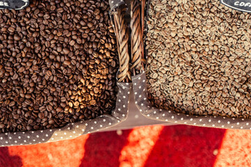 Roast coffee beans of robusta and arabica in wooden basket Turkish market. Different degrees of coffee roasting.