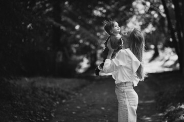 Mother with baby daughter together in park