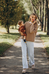 Obraz premium Mother with baby daughter together in park