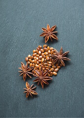 Seeds of star anise on grey stone background, Christmas decoration