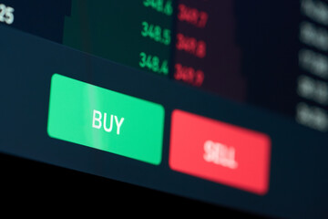 Buy or sell buttons concept. Close up computer screen view background of stock exchange market...