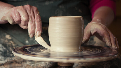 Fototapeta na wymiar Hands of a potter at work