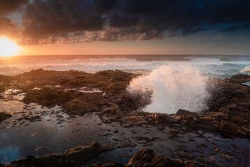 Waves out of Thor's well at sunset