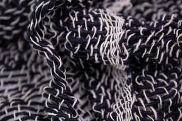 Black and White Handicraft Clothes on White Background .
Close up Detail of Hand Woven Cotton Scarf ,
Design texture and Pattern by Artisans in Northern Villages of Thailand