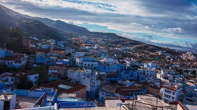 Aerial timelapse view of the beautiful Chefchaouene town in Morocco. Colorful blue houses by the mountains. Magical Morocco traditional village.
