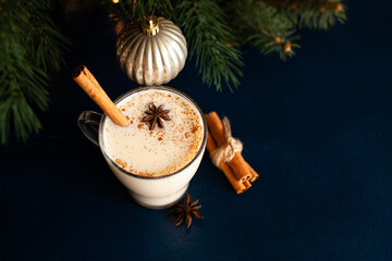 homemade traditional Christmas drink eggnog with spices and cinnamon. Winter holidays.