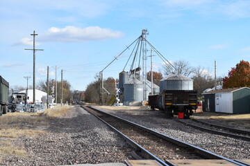Fototapeta na wymiar Train Tracks by a Grain Elevator in a Small Rural Town