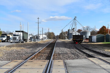 Fototapeta na wymiar Railroad Tracks by a Grain Elevator