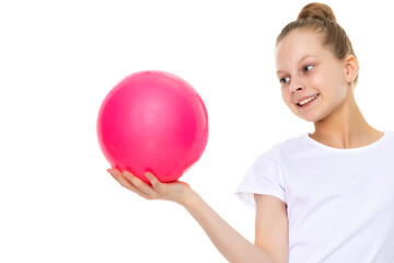 little girl is engaged in fitness with a ball.