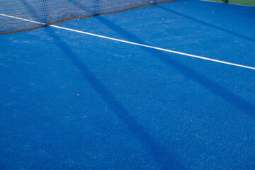 Blue paddle tennis court field with white lines background
