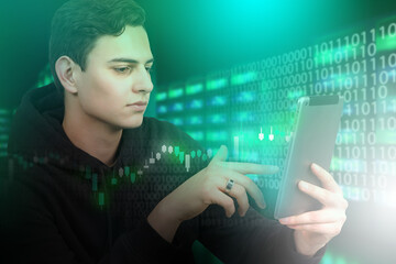 programmer works in fin tech sphere. Fin tech industry. Financial technologies. Financial data center administration. Guy with tablet in server room. Investment charts next to it. Developer fin tech