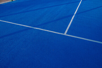 Blue paddle tennis court. Blue court with white lines. Horizontal sport poster, greeting cards,...