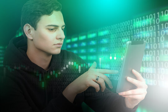 programmer works in fin tech sphere. Fin tech industry. Financial technologies. Financial data center administration. Guy with tablet in server room. Investment charts next to it. Developer fin tech