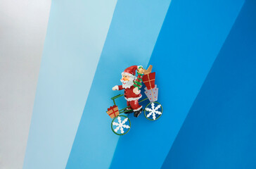 Santa claus with gifts on a bicycle, christmas tree decoration