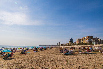 seaside landscape with a beach in the Spanish city of Alicante on a warm sunny day