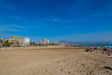 seaside landscape with a beach in the Spanish city of Alicante on a warm sunny day