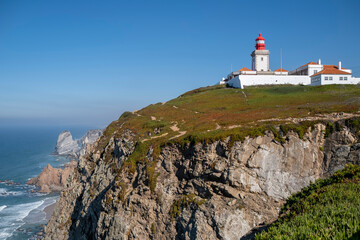 Fototapeta na wymiar View of the Cabo da Roca Lighthouse. Portuguese Farol de Cabo da Roca is a cape which forms the westernmost point of the Eurasian land mass.