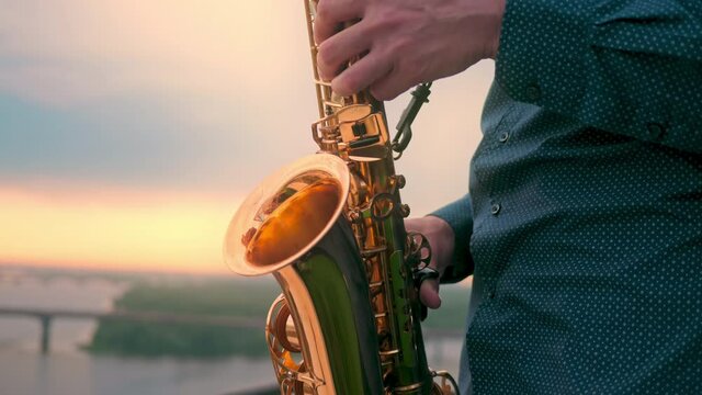 Musician playing saxophone on city house art sax jazz