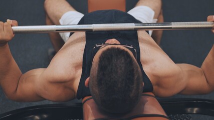 Fototapeta premium An Arab man pumps his chest in the gym.