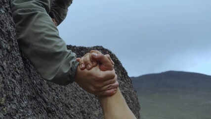 Mutual assistance. Hands on the background of mountains. Help people. Support and mutual assistance