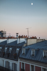 moon and moonlight over the roofs of Paris Montmartre 