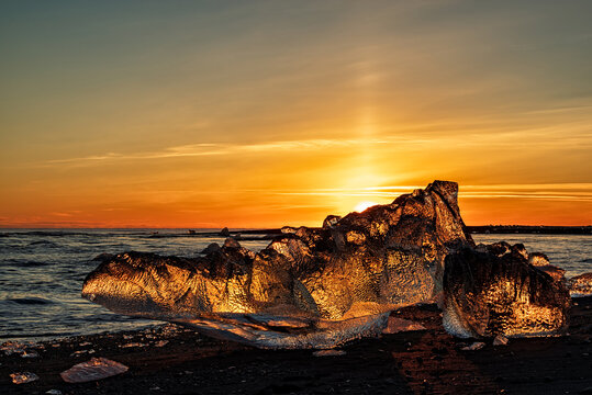 Icebergs in diamond beach in Vatnajokull National Park at sunset, Iceland