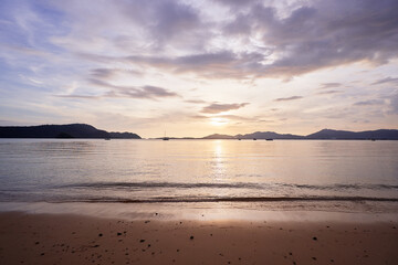 Naklejka na ściany i meble Beautiful seascape with cloudy sky. Sunset on the beach.