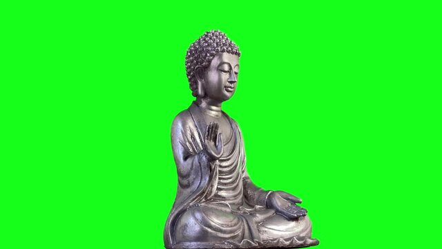 A Metallic Buddha against Green Screen. Zoom In. Close Up. You can replace green screen with the footage or picture you want with “Keying” effect in After Effects. 4K Resolution. 