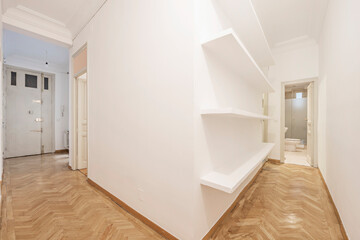 Corridors of a house with parquet floors, plaster shelves and freshly painted walls