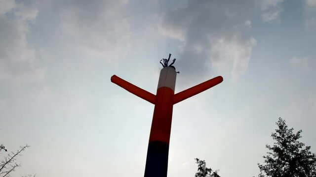 Tube Man - Looking Up Of Air Dancer Against Sky On ABright Day. - low angle